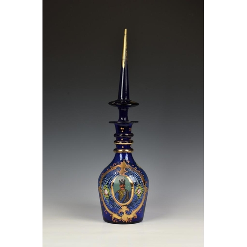 317 - A Bohemian Persian cobalt blue and enamel decanter, probably mid 20th century, with triple ring neck... 