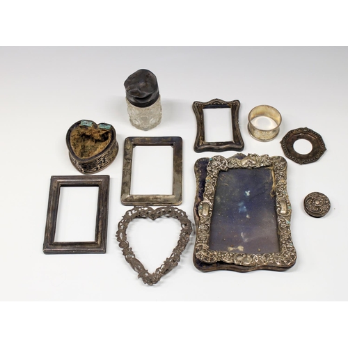 331 - A collection of scrap silver, to include photo frames of varying forms, perfume jars, etc, gross wei... 