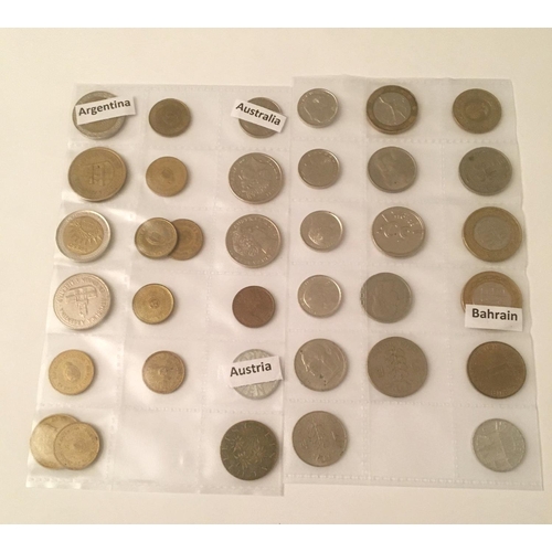 347 - Numismatics - A large collection of Worldwide coinage, contained in two binders, comprising coins fr... 