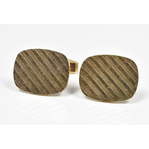356 - A pair of 9ct yellow gold cufflinks, of oval form with engine turned decoration, 10g.