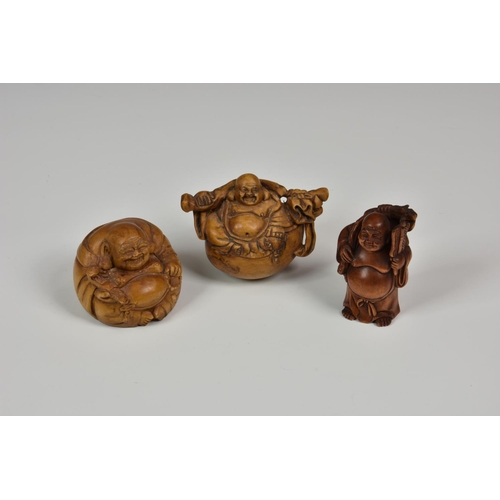 911 - Three 20th century figural / Hotei carved Japanese netsuke, each signed.
