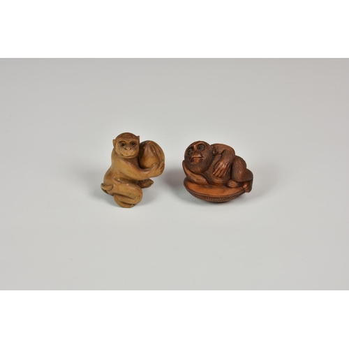 912 - Two 20th century carved Japanese macaque netsuke.