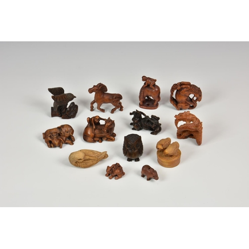 914 - A collection of thirteen (13) 20th century carved Japanese netsuke, of varying forms to include monk... 