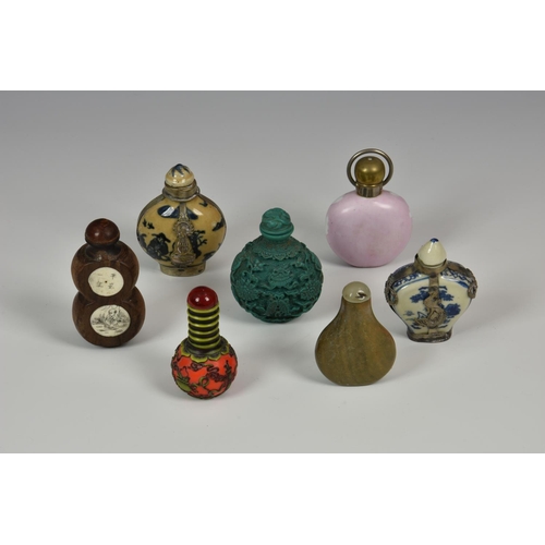918 - A collection of seven 20th century and early porcelain / stone and other Chinese snuff bottles, of v... 