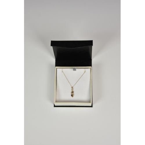 924 - A 9ct gold, sapphire and diamond drop pendant, on a 9ct gold 16in. curb link trace chain.