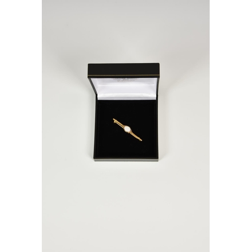 935 - A 9ct gold and white opal bar brooch,