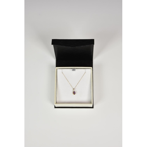 936 - A 9ct gold, amethyst and diamond pendant, on an 18in. 9ct gold trace chain.