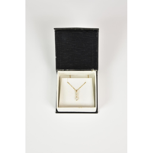 938 - A 9ct gold and CZ three stone pendant, on a 16in. 9ct gold curb link chain.
