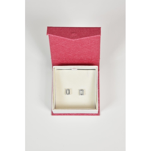 941 - A pair of 9ct white gold and pale topaz stud earrings,