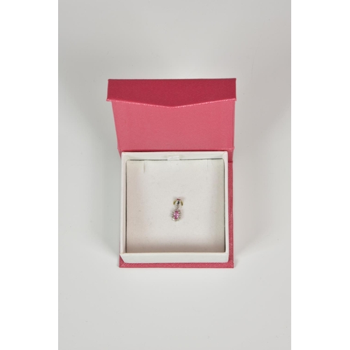 943 - A 9ct white gold, pink stone and diamond cluster pendant,