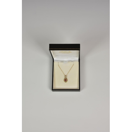 944 - A 9ct yellow gold, ruby and diamond pendant, on a 16in. 9ct gold curb link chain.