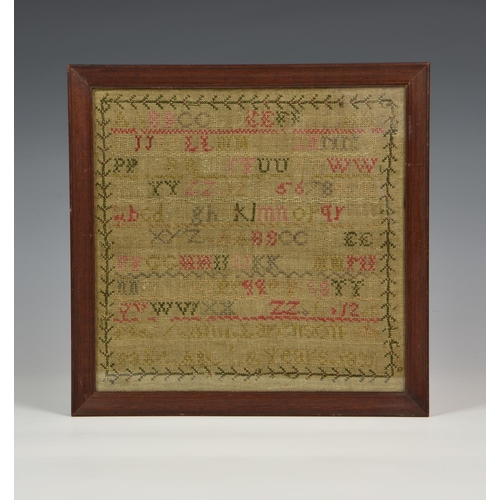 962 - A William IV needlework alphabet sampler, dated 1831, other lettering to signature panel indistinct,... 
