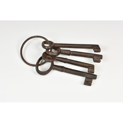 967 - A ring of jailers keys - antique style jail skeleton keys. (4),