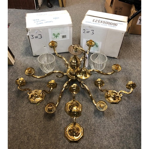 310 - A modern brass and cut glass chandelier, together with four matching wall lights, two single stem an... 