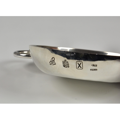 1014 - A Channel Islands silver tastevin, Bruce Russell, Guernsey, 1997, of typical form with loop handle, ... 