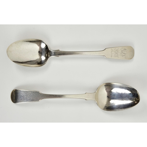 1023 - A pair of Channel Islands silver fiddle pattern table spoons, maker's mark struck once beneath termi... 