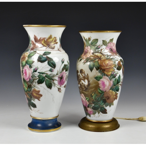 154 - Two floral decorated Bohemian opaline glass vases with cherubs, one converted to a lamp (drilled) , ... 