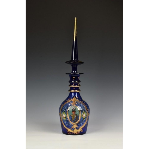 183 - A Bohemian Persian cobalt blue and enamel decanter, probably mid 20th century, with triple ring neck... 