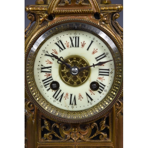 211 - A French cast and pierced brass mantel clock, late 19th century, the Renaissance style case with lan... 