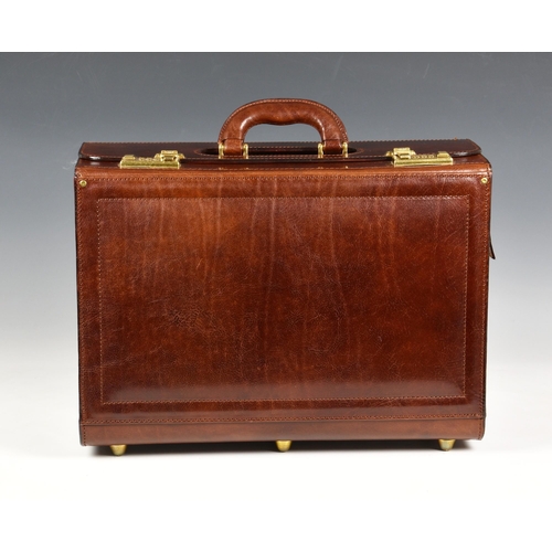 An Italian leather briefcase, stamped 'Firenze', the midbrown leather