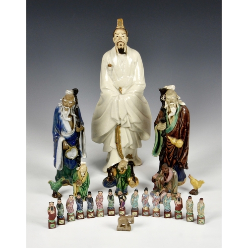 2256 - A collection of Chinese stoneware and porcelain figures, 20th century, comprising a large stoneware ... 
