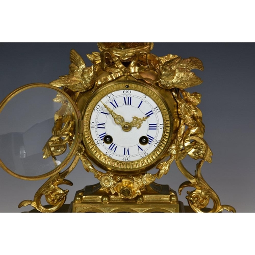 230 - A 19th century ormolu mantel clock in the manner of Jules Moigniez, the twin train movement with out... 