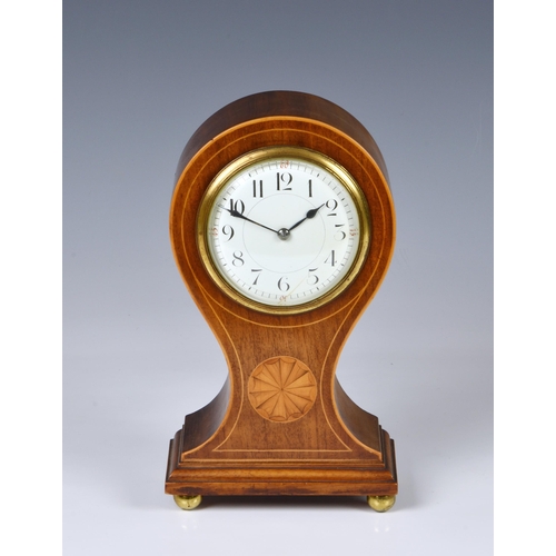 253 - An Edwardian inlaid mahogany mantel clock, the balloon case with boxwood stringing and fan patera, o... 