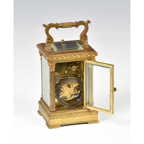 264 - A French gilt brass carriage clock with repeat, c.1900, with Corinthian column case, Roman white ena... 