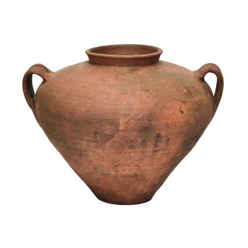 2868 - A twin handled terracotta oil jar or water vessel, of bulbous amphora form, having wide shoulders an... 