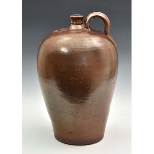 2869 - A stoneware salt glazed wine flagon, probably 19th century, of typical form with high loop handle, i... 