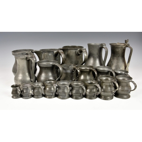 2870 - A collection of 18th century and later pewter measures of varying forms, to include a matched gradua... 