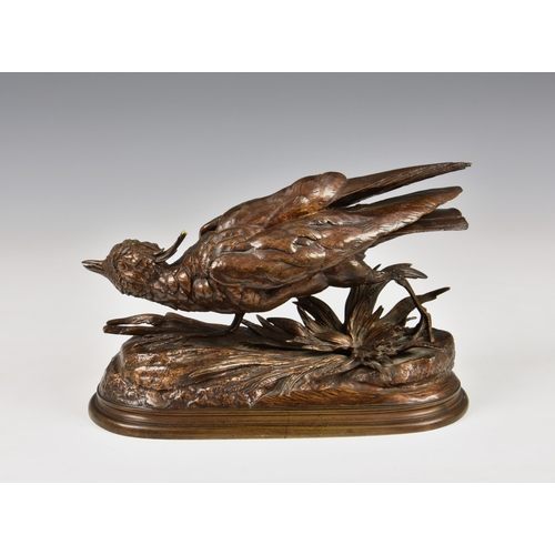 2877 - After Jules Moigniez (French, 1835-1894), a gilt bronze study of a pheasant, on naturalistic oval ba... 