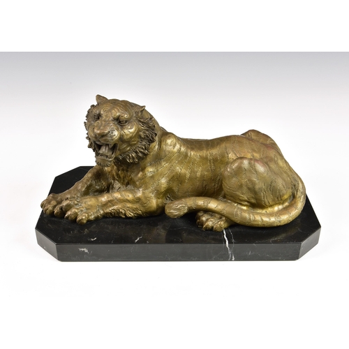 2879 - A contemporary polished bronze sculpture of a recumbent tiger, raised on shaped rectangular black ma... 