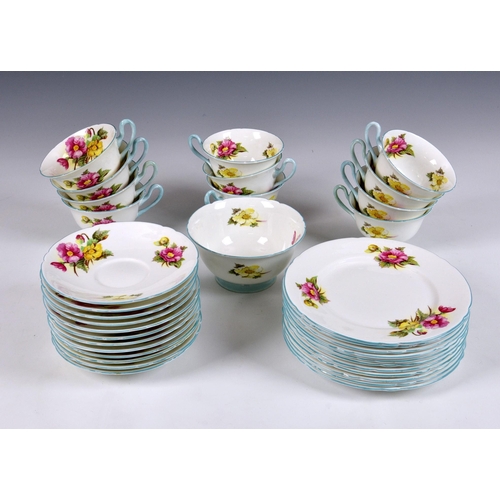 45 - A partial set of eleven Shelley Begonia pattern trios, each trio comprising a tea cup, saucer and pl... 