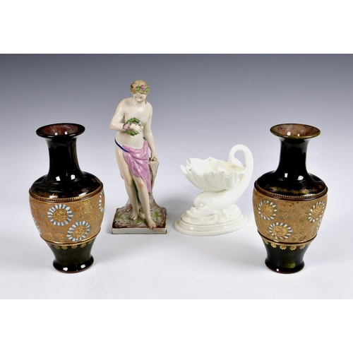 64 - A small collection of antique ceramics, to include a Continental earthernware semi-nude female figur... 