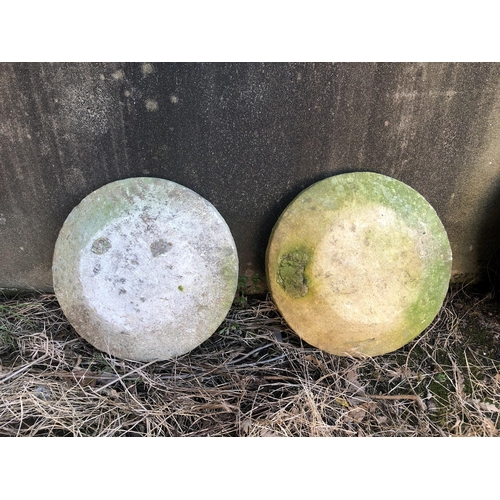 704 - Two sandstone staddle stone caps, 18 ¾in. diameter. (2)