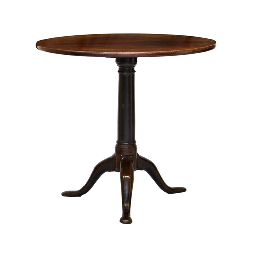 766 - A George III mahogany tilt-top tripod supper table, the circular top on a turned gun barrel column t... 