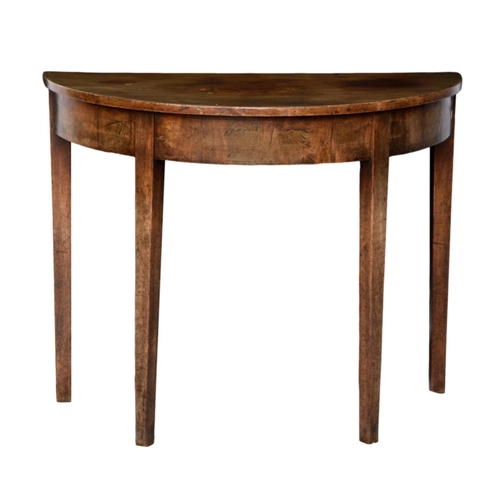 784 - A George III mahogany demi-lune dropflap supper table, the top opening on a gateleg, raised on squar... 