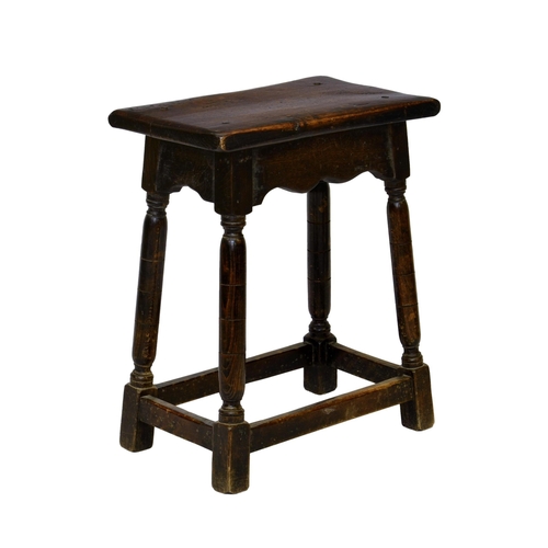 810 - An 18th century style beech and oak joint stool, first half 20th century, the rectangular seat over ... 