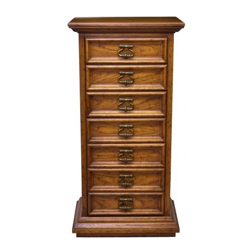 861 - A matching honey oak tall, seven drawer chest of drawers, 24 x 17in. (61 x 43.2cm.), 48in. (122cm.) ... 