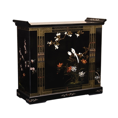 864 - A Chinese black lacquered and painted drinks cabinet, third quarter 20th century, painted to the fro... 