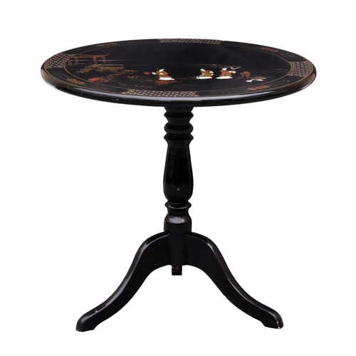 868 - A Chinese black lacquered and painted tilt top tripod table, third quarter 20th century, the circula... 