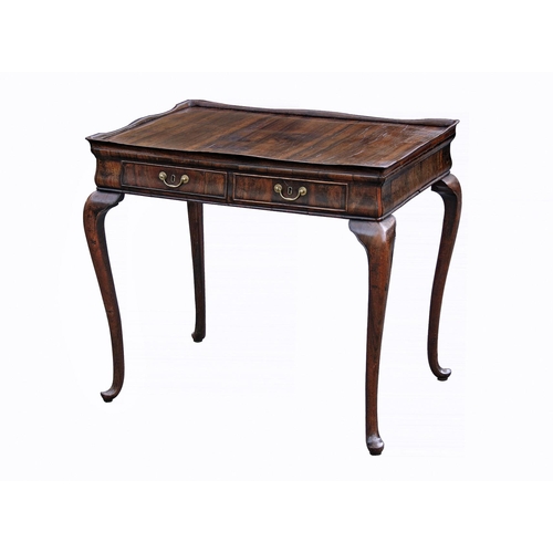 880 - An unusual George II silver table, in an exotic veneer with dark striping, the tray top with serpent... 