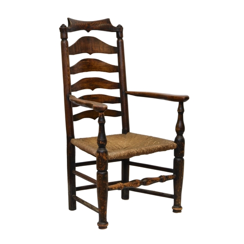 884 - A George III stained beech and oak ladder back armchair, the shaped, scrolled top rail over a shaped... 