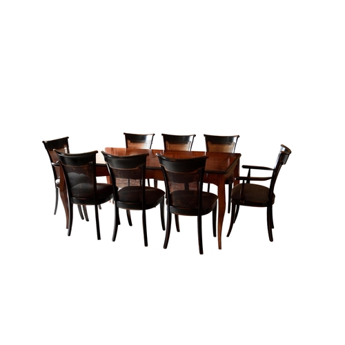 892 - A northern French (Brittany) cherry wood and ebonised extending dining table and chairs, late 20th c... 