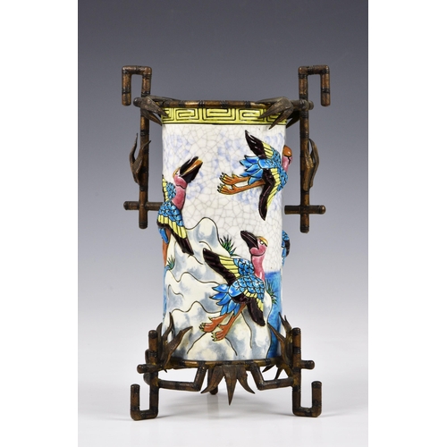 97 - An unusual French Longwy Pottery vase, having applied moulded flying birds in bright enamels on crac... 