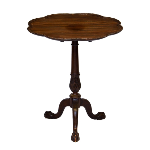 989 - A George III style mahogany tilt-top tripod table, c.1900, the scalloped dished top with bead and re... 