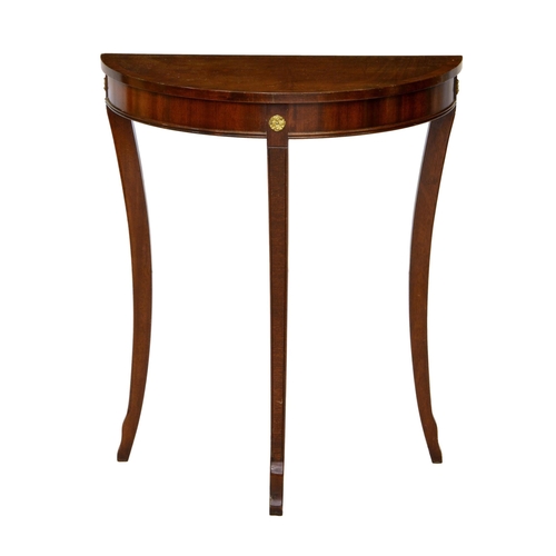 992 - An Empire style mahogany console table, late 20th century, the cross banded demi-lune top over a gil... 