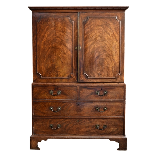 993 - A good George III linen press mahogany linen press
of small proportions, c.1780, the key carved corn... 