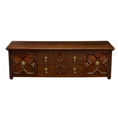 995 - A 1920s low panelled oak chest